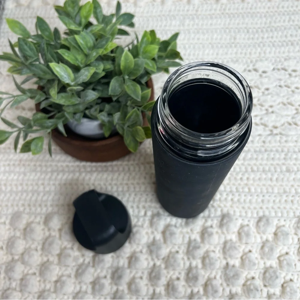PELOTON Workout Glass Water Bottle with Lid Silicone Sleeve Black Logo